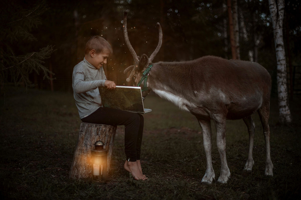magical child and reindeer photo